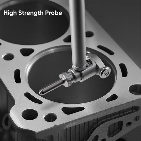 Close-up of a silver dial indicator bore gauge inserted into an engine cylinder bore for internal diameter measurement