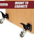 Four Rock Solid Retractable Casters Featuring Quick Release Mounting Plates For No Sweat Workbench Relocation And Lets Heavy Shop Gear Roll Out Smooth As Butter mounted to wooden cabinet.