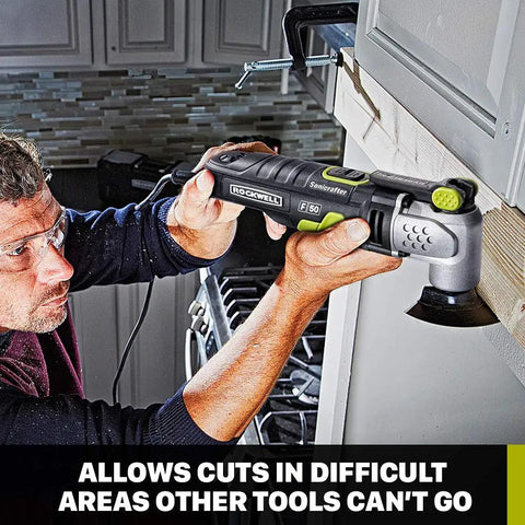 Man using F50 Sonicrafter Oscillating Multi Tool With 4.0 Amp Motor, Variable Speed, Hyperlock Tool Free Blade Change on cabinet