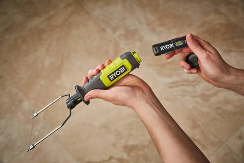 4V Cordless Hot Foam Cutter With 2.0Ah Battery held in hand with battery pack, showcasing ergonomic design for model making and crafts.