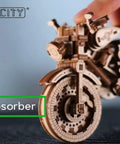 Close-up of Cruiser V-Twin 3D Puzzle Kit for Adults showing front wheel and shock absorber detail, Interactive Wooden Motorcycle Model Build.