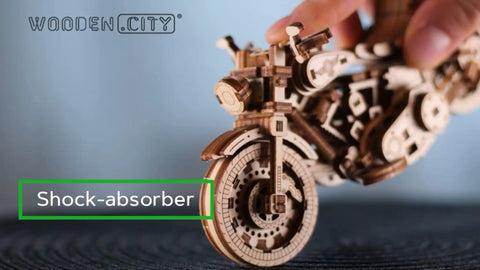 Close-up of Cruiser V-Twin 3D Puzzle Kit for Adults showing front wheel and shock absorber detail, Interactive Wooden Motorcycle Model Build.