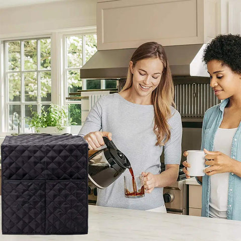 Waterproof Coffee Maker Cover For Keurig Single Serve Brewers in black, protecting a coffee maker on a kitchen counter, diamond-quilted.