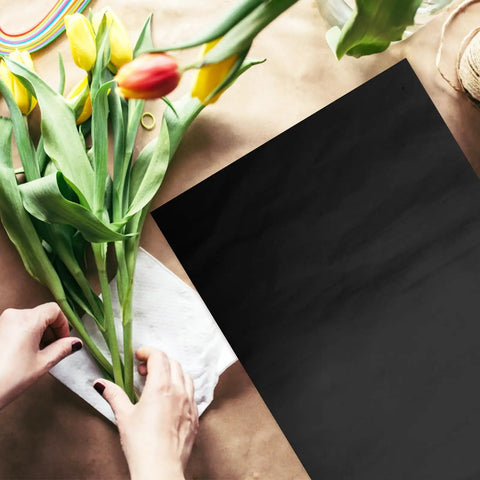 40 Sheets Flower Wrapping Paper For Bouquets And Gifts, Lightweight Floral Paper With Cuttable Design on table with tulips