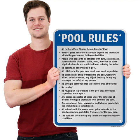Man holding Pool Rules Sign 24 X 18 Inch Must Shower No Spitting No Diving No Running Aluminum Exterior Sign 80 Mil Laminated Rustproof