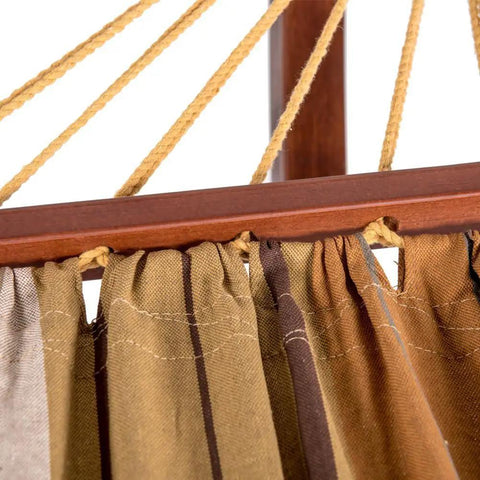Close-up of Two Person Cotton Fabric Hammock With Spreader Bars And 10.5 Ft Wood Arc Stand showing brown and khaki fabric.