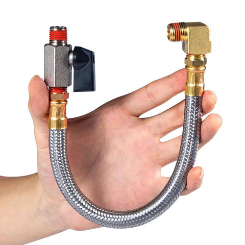 Hand holding Extended Tank Drain Valve Assembly Kit For Air Compressors With Ten Inch Braided Steel Hose One Quarter Inch NPT