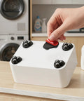Twelve Pieces Self Adhesive Mini Casters And Swivel Ball Wheels That Roll Smooth As Butter For Trash Cans Storage Bins And Kitchen Organizers With Easy Peasy Sticky Backing To Boost Home Storage Game Today in use on a white box.