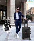 Man with lightweight softside carry on luggage with spinner wheels, black color, TSA lock, airline approved, 22x9x14 cabin size.