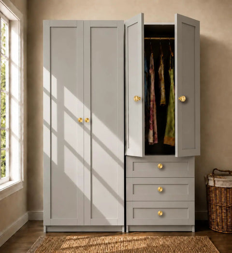 Slick Brushed Gold Cabinet Knobs Two Pack Modern Three Groove Handle Style on gray wardrobe doors with open drawers.