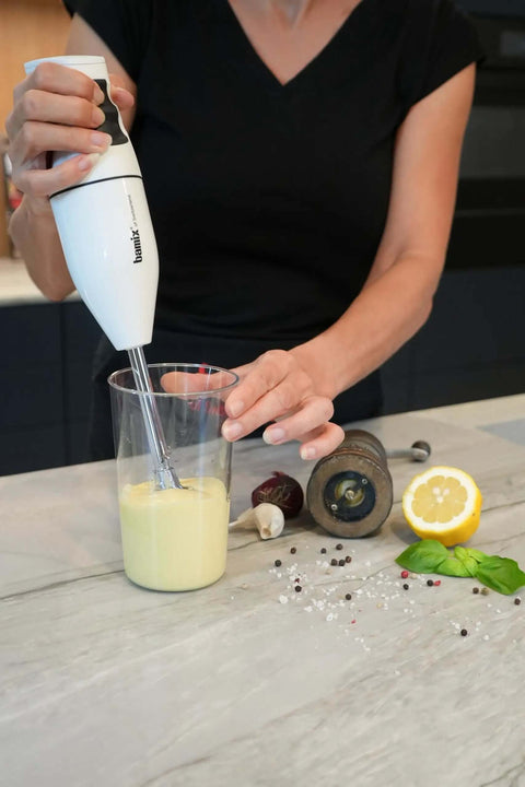 Top Shelf Swiss Made Classic Immersion Blender With 150W Motor and Two Speed Settings in action blending a creamy mixture.
