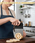 Two-piece crinkle cutter set with ergonomic black handle and stainless blades, slicing lotus root on a cutting board.