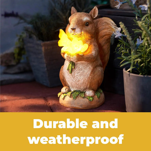 Charmed Solar Powered Led Outdoor Decor Porcelain Squirrel Figurine Light Up Garden Statue with lit night glow on patio