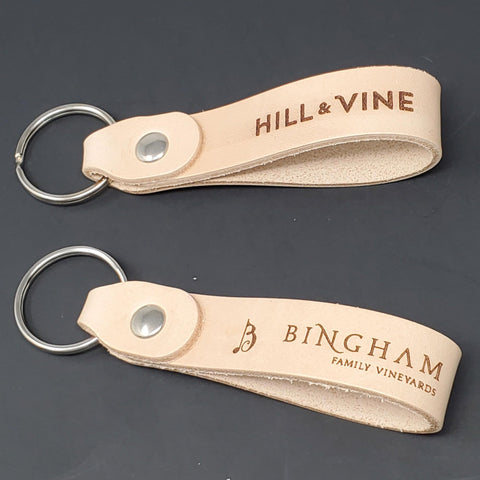 Top Shelf Natural Veggie Tan Leather Keychain Blanks 10 Pack with engraved designs, thick straps for custom crafting.
