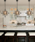 Dope Moravian Star Pendant Light With Clear Glass Shade In Black Finish 16 Inch Height Adjustable Pendant Fixture over kitchen island