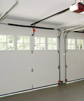 Interior view of a garage with doors showcasing the installation space for Garage Door Torsion Spring 0.243 Inch Wire Size, 2 Inch ID.