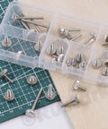 35Pcs M3 Nickel Plated Knurled Thumb Screws Set In 7 Sizes M3x6mm to M3x30mm shown in storage box and scattered on surface