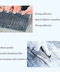 Heavy Duty Aluminum Foil Tape Self Adhesive Roofing Flashing Sealant Waterproof Underlayment Roll being held, showing strong adhesion and quality.