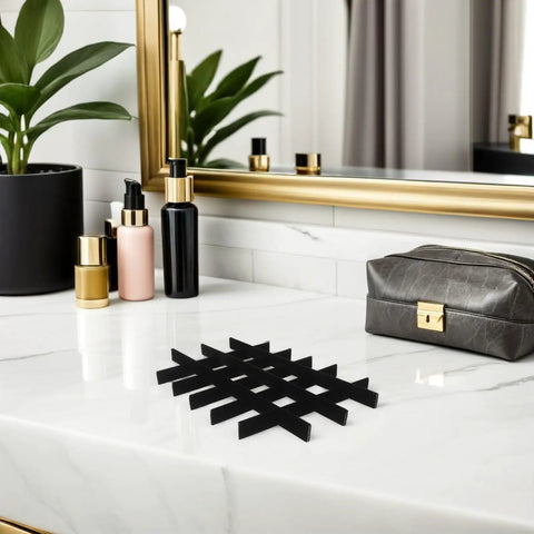 Adjustable Jewelry Organizer With Ultra Soft Sponge Lining And Removable Grid Dividers Keeps Your Bling Stash Hella Organized Compact Black Drawer Insert on a marble surface.