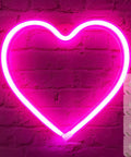 Pink Neon Heart LED Light For Bedroom Or Living Room USB Or Battery Operated Mood Lamp With Four Hooks on brick wall