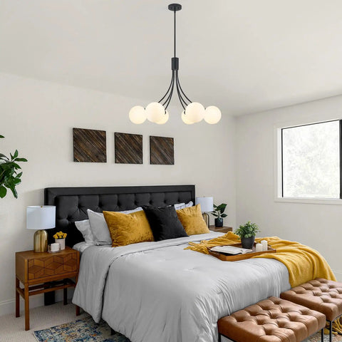 Modern bedroom with black and gold pendant light above bed, featuring Wagon Wheel Chandelier With Vintage Wood Grain Look, Dope 6 Light.