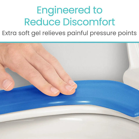 Hand touching Gel Toilet Seat Cushion Pad With Raised Padded Riser For Elongated And Standard Toilet Seats And Commode Chairs 0.6 Inch Thick Gel Pad Delivers Pressure Relief And Pain Relief Comfy Seat Warmer And Adhesive Donut Pad For Seniors