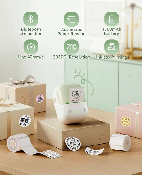 No Sweat Portable Label Maker With Bluetooth And One Touch Offline Printing For Sweet Home Office Organization Ready To Roll Including Tape In Classic Green White Finish on a wooden desk with labels and gifts.