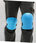 Heavy Duty Work Knee Pads For Men And Women With Tight Non Slip Grip Two Pairs In Sharp Blue And Black on black pants.