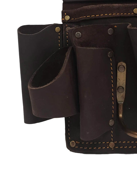 Close-up of oil tanned leather drywall tool pouch with hammer loop, double stitching, 12 pockets for hammers, screwdrivers, saws.