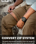 Man demonstrating the zip-off feature on Mens Convertible Cargo Pants For Hiking And Work Water Resistant Zip Off Stretch Tactical Pants.