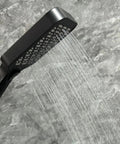 Upgrade Your Bathroom with This Matte Black Handheld Shower System - Adjustable Slide Bar & Hose High-Pressure Spray Easy-Clean Silicone Nozzles with water streaming.