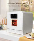Portable Countertop Dishwasher With Built In Water Tank And Pull Rack Features 360 Dual Spray Arms Hot Dryer displayed on kitchen counter.