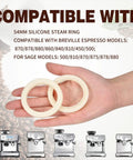 Hand holding two 54mm Silicone Steam Ring Replacement Gaskets for Espresso Machines Dope Fit On Breville And Sage Models