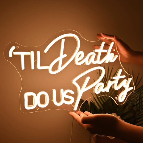Til Death Do Us Party Neon Light Sign For Wedding Reception And Bridal Shower Backdrop Bedroom Wall Decor 17 Inch Warm White LED held by hands