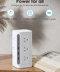 Must Have Boss Level Compact Power Tower Surge Protector with USB Ports on a wooden table next to an open book.