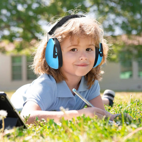 Child wearing blue earmuffs from 9 Pack Kids Earmuffs For Noise Reduction 29dB Adjustable Fit Ear Protection For Toddlers And Kids Sound Blocking