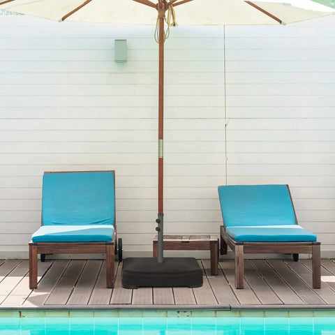 Heavy Duty Beefy 220 Pound Patio Umbrella Base With Sandbags by poolside with loungers, stabilizes large 15 Ft umbrella, fits 1.9 inch poles