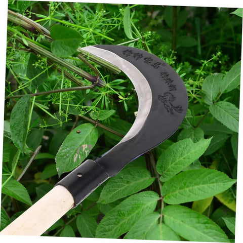 Long Handle Manganese Steel Hand Scythe for Weeding and Gardening with comfy grip shown cutting green plants