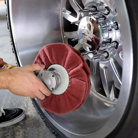 Four Inch Airway Flange Kit for Angle Grinder with Five Eighth Inch Arbor Hole Buffing Wheel in use on wheel rim