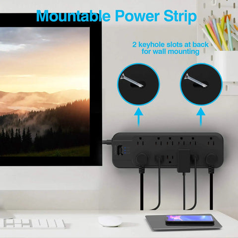 Dual 4800 Joule Surge Protector Power Strip With 12 Outlets mounted on wall under TV, cords connected, black.