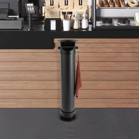 Floor standing espresso knock box, 34-inch tall, large capacity, in a cafe setting with anti splash deep bowl and towel hanging.