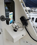 Heavy Duty Magnetic Phone Mount For Trucks, Tractors, Forklifts And Boats, Fits 3.5 To 7.5 Inch Smartphones, shown on boat helm