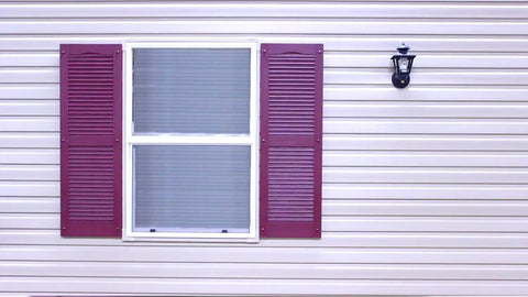 Premium Heavy Duty Vinyl Shutter Fastener Spike Lok Anchors on purple shutters against vinyl siding.