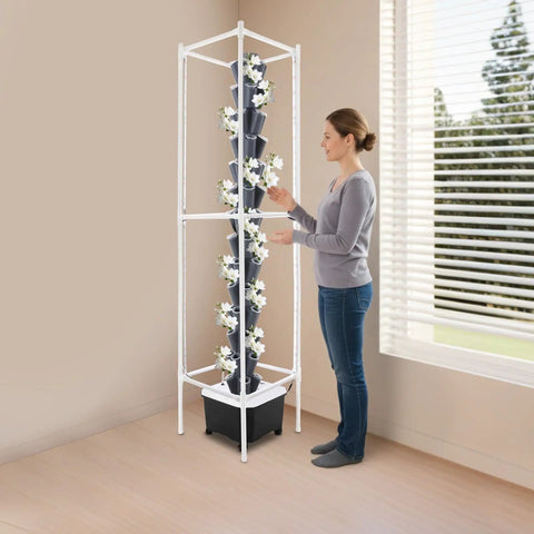 Person adjusting Vertical Hydroponic Garden Tower With 70 Pods And 14 Tiers, grey indoor system near window