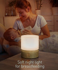 Dimmable LED Night Light With Timer For Nursery And Kids Bedroom, Woodgrain Bedside Lamp illuminating a mother feeding her baby.