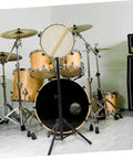 Rock Solid Foldable Drum Stand With Hella Sturdy Alloy Frame for snare during practice setup in a modern studio.