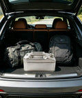 Heavy Duty 304 Stainless Steel Water Storage Canister 10 Liter Liquid Container in car trunk with bags.
