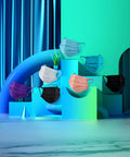 4 Layer Individually Wrapped Disposable Face Masks 50 Pcs Rainbow Color With 5mm Wide Earloops, colorful masks displayed artistically