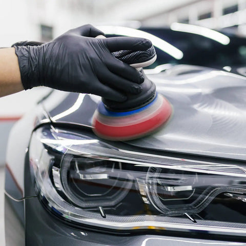 Polishing car headlight with 5 Inch 8 Hole Orbital Sanding Discs Set for a smooth finish