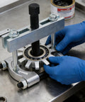 Heavy Duty Bearing Splitter And Five Inch Gear Pulley Puller Set For Wheel Hubs Pinions And Crankshafts on a workbench